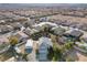 Aerial view of a meticulously maintained single Gathering residence with a large detached garage and mature landscaping at 9435 Westwind Rd, Las Vegas, NV 89139