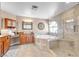 Luxurious bathroom featuring a soaking tub, walk-in shower, and vanity with great storage at 9435 Westwind Rd, Las Vegas, NV 89139