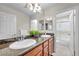 Bathroom with double vanity, granite countertops, and a glass-enclosed shower at 9435 Westwind Rd, Las Vegas, NV 89139