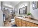 Bathroom featuring walk-in shower, wood vanity and ample counter space at 9435 Westwind Rd, Las Vegas, NV 89139