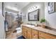 Bathroom features a custom vanity, framed mirror, and glass-enclosed shower for a modern touch at 9435 Westwind Rd, Las Vegas, NV 89139