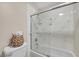 Bathroom with a shower-tub combo with modern glass doors and stylish decor at 9435 Westwind Rd, Las Vegas, NV 89139
