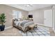 Comfortable bedroom with stylish decor, plush carpeting, and a well-lit ambiance at 9435 Westwind Rd, Las Vegas, NV 89139