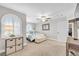 A neutral bedroom with natural lighting, a large bed, and a storage chest at the foot of the bed at 9435 Westwind Rd, Las Vegas, NV 89139