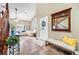 Bright foyer with tile flooring, bench seating, and a view into the cozy living room at 9435 Westwind Rd, Las Vegas, NV 89139