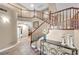 Beautiful foyer featuring dark wood staircase at 9435 Westwind Rd, Las Vegas, NV 89139