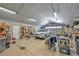 Spacious garage interior with ample storage, room for a car, and corrugated steel walls and ceiling at 9435 Westwind Rd, Las Vegas, NV 89139