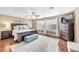 Spacious primary bedroom with hardwood floors, a ceiling fan, and natural light at 9435 Westwind Rd, Las Vegas, NV 89139