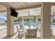 Relaxing outdoor seating area with ceiling fan and TV is ideal for entertaining guests at 9435 Westwind Rd, Las Vegas, NV 89139