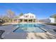 Back of house with large in-ground pool and covered patio at 9435 Westwind Rd, Las Vegas, NV 89139