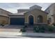 Charming stucco home featuring a two-car garage and a professionally landscaped front yard at , Las Vegas, NV 89178