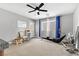 Spacious bonus room featuring a ceiling fan, natural light, and a workout station at 10415 Scarpa St, Las Vegas, NV 89178