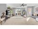 Bright bonus room with hanging chair, seating, and natural light from the sliding door at 10415 Scarpa St, Las Vegas, NV 89178