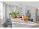 Bright dining area filled with plants, natural light from a window, and a modern table at 10415 Scarpa St, Las Vegas, NV 89178