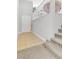 Inviting entryway features neutral tile flooring, a white door, and stairway leading to the upper level at 10415 Scarpa St, Las Vegas, NV 89178