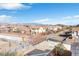 Scenic view of the neighborhood with pedestrian bridge and mountain backdrop at 10415 Scarpa St, Las Vegas, NV 89178