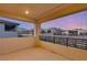 Balcony with modern railing and a neighborhood and mountain view during sunset at 12160 Harris Summit Ave, Las Vegas, NV 89138