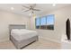 Bedroom featuring neutral carpeting, ceiling fan, and a gray bedframe at 12160 Harris Summit Ave, Las Vegas, NV 89138