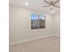 Well-lit bedroom with a ceiling fan and large window overlooking the neighborhood at 12160 Harris Summit Ave, Las Vegas, NV 89138