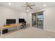 This bedroom offers a ceiling fan and a sliding glass door leading to the outside at 12160 Harris Summit Ave, Las Vegas, NV 89138