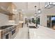 Spacious modern kitchen featuring an island, stainless steel appliances, and an open floor plan at 12160 Harris Summit Ave, Las Vegas, NV 89138