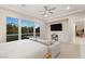 Well-lit bedroom featuring large windows, built-in storage and desk, with a contemporary design at 12160 Harris Summit Ave, Las Vegas, NV 89138