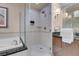 This bathroom has a bright white shower and soaking tub, with a double vanity nearby at 125 E Harmon Ave # 809, Las Vegas, NV 89109