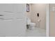Powder room with a white toilet and neutral walls at 125 E Harmon Ave # 809, Las Vegas, NV 89109