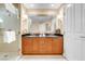 Elegant bathroom featuring double sinks, a large mirror, and a glass shower at 125 E Harmon Ave # 809, Las Vegas, NV 89109