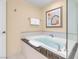 Bathroom with soaking tub with black trim and enclosed glass shower at 125 E Harmon Ave # 809, Las Vegas, NV 89109
