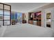 Bedroom with a king bed, dining table, city view, and a TV over the kitchenette at 125 E Harmon Ave # 809, Las Vegas, NV 89109