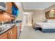 Comfortable bedroom featuring a mini kitchen, sitting bench, and inviting decor at 125 E Harmon Ave # 809, Las Vegas, NV 89109