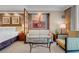 Comfortable bedroom with adjacent sitting area and artwork at 125 E Harmon Ave # 809, Las Vegas, NV 89109