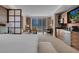 Bedroom with large window and city view, comfortable seating, and modern kitchenette at 125 E Harmon Ave # 809, Las Vegas, NV 89109