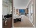 Bright bedroom featuring a large window, seating area, and convenient kitchenette at 125 E Harmon Ave # 809, Las Vegas, NV 89109