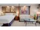Bedroom with queen bed, sitting area, and city views at 125 E Harmon Ave # 809, Las Vegas, NV 89109