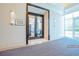An entrance to the fitness center showcases double doors and a glimpse of modern exercise equipment at 125 E Harmon Ave # 809, Las Vegas, NV 89109