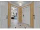 Hallway with doors leading to rooms, featuring tile flooring and neutral wall colors at 125 E Harmon Ave # 809, Las Vegas, NV 89109