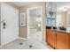 Tiled hallway leading to a bathroom with a bathtub and shower at 125 E Harmon Ave # 809, Las Vegas, NV 89109