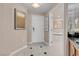 Hallway view with a bathroom featuring a soaking tub through an open doorway at 125 E Harmon Ave # 809, Las Vegas, NV 89109