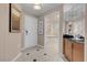 Hallway view with a bathroom featuring a soaking tub through an open doorway at 125 E Harmon Ave # 809, Las Vegas, NV 89109