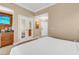 Kitchenette featuring wood cabinets, sink, microwave, refrigerator, and wall-mounted television at 125 E Harmon Ave # 809, Las Vegas, NV 89109