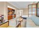 Comfortable living area featuring a kitchenette, seating area, and a view into the bedroom at 125 E Harmon Ave # 809, Las Vegas, NV 89109