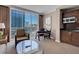 Charming living area featuring city views, plush seating, and a stylish coffee table at 125 E Harmon Ave # 809, Las Vegas, NV 89109