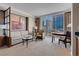 Bright living room showcasing floor-to-ceiling windows and comfortable seating at 125 E Harmon Ave # 809, Las Vegas, NV 89109