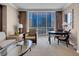 Cozy living room with city views, comfortable seating, and a glass-topped coffee table at 125 E Harmon Ave # 809, Las Vegas, NV 89109