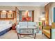 Bedroom showcasing a king bed, sitting area, and decorative wall art at 125 E Harmon Ave # 809, Las Vegas, NV 89109