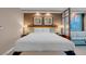 Comfortable bedroom featuring a king bed, stylish lighting and a cozy sitting area at 125 E Harmon Ave # 809, Las Vegas, NV 89109