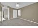 A lovely bedroom features a spacious closet, neutral walls, soft carpeting, and overhead lighting at 12816 Alcores St, Las Vegas, NV 89141