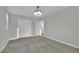 Bedroom featuring carpeted floors, ceiling fan, window and closet at 12816 Alcores St, Las Vegas, NV 89141